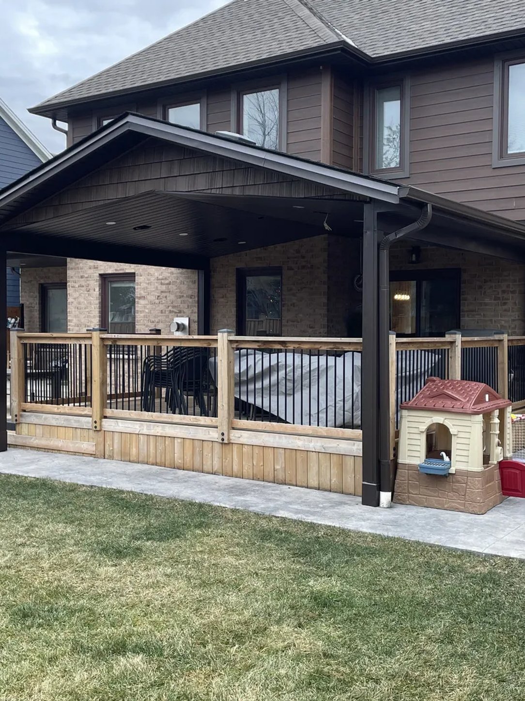 Finished covered porch renovation by Crowle Construction GC