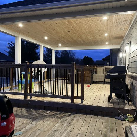 Covered deck with finished lighting